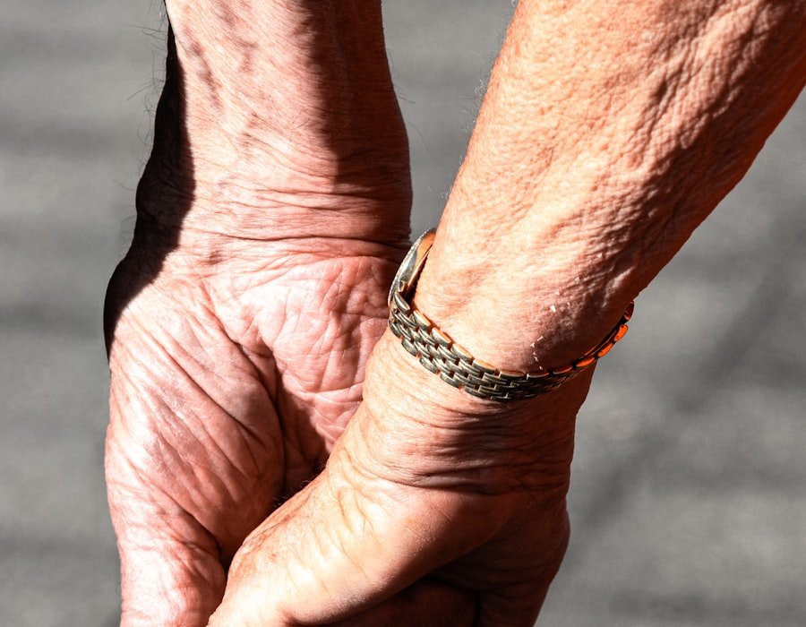 A close view of an older person's hands resting together