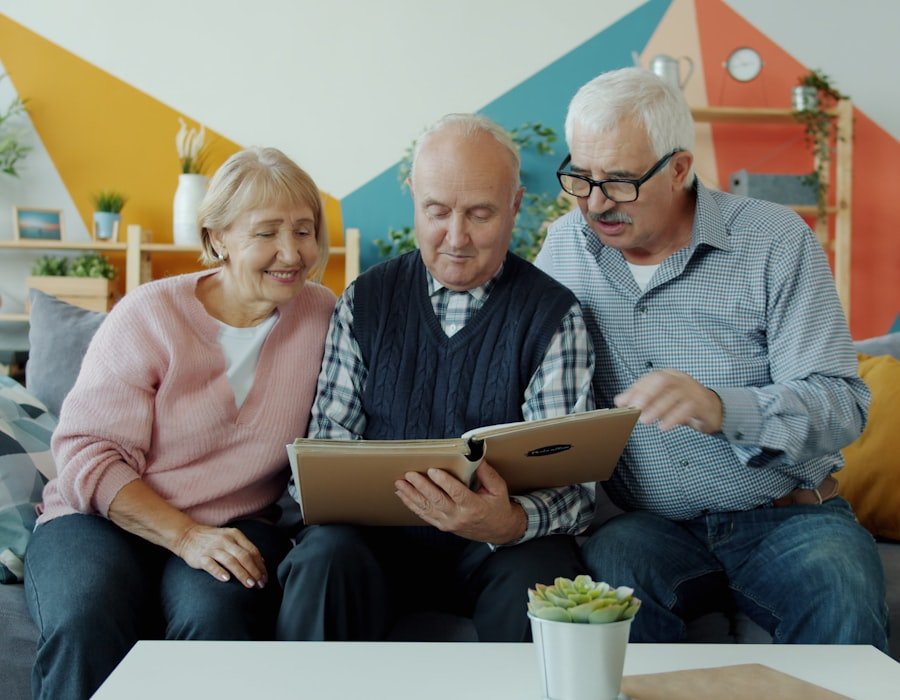 Older adults sitting together at home looking at a tablet