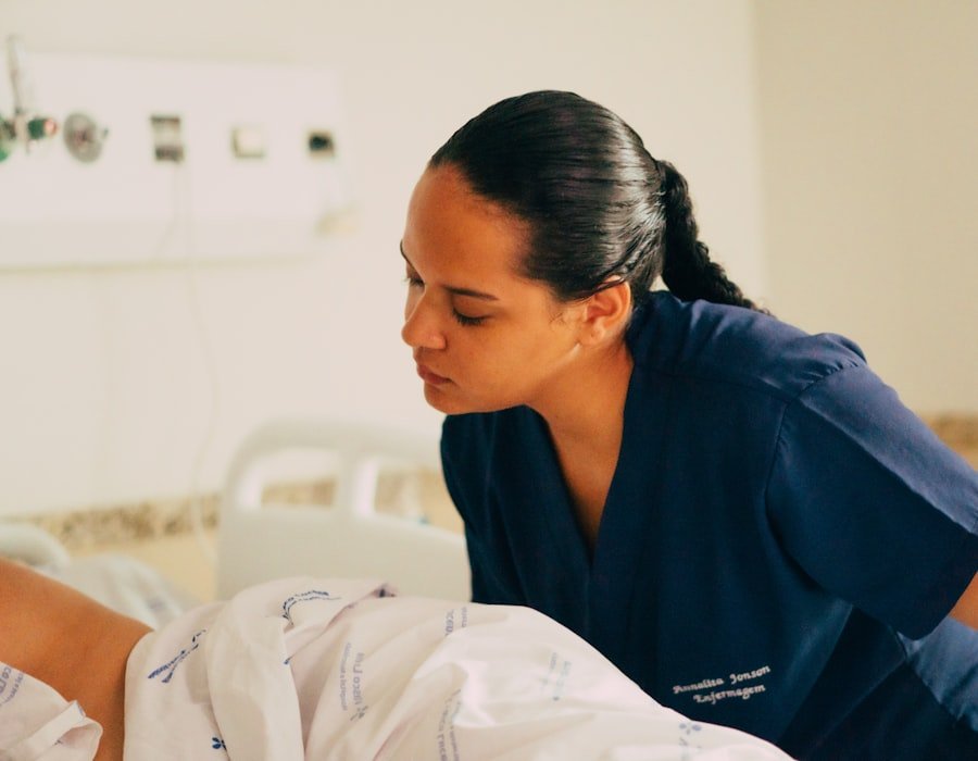 A nurse attending carefully to a patient resting in bed